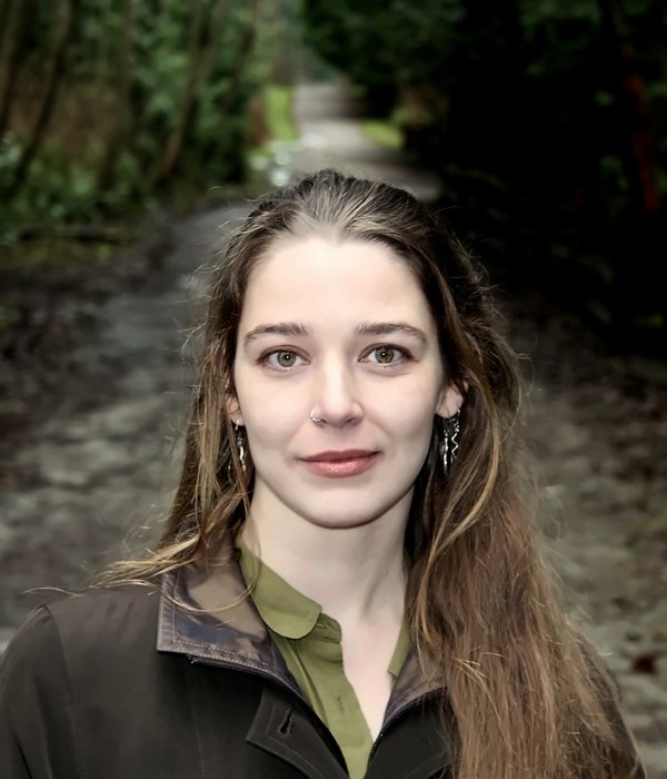 Portrait of Emily Lawson on a forest path